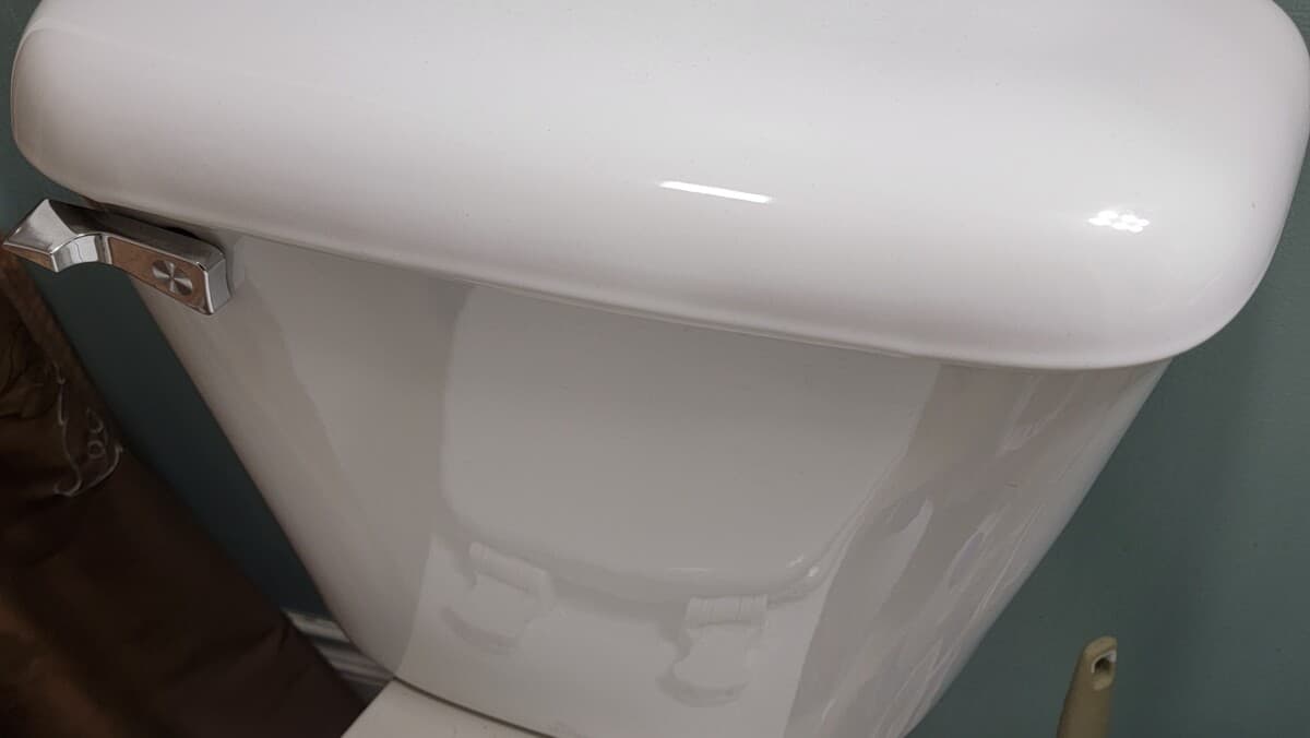 image of toilet tank that won't hold water