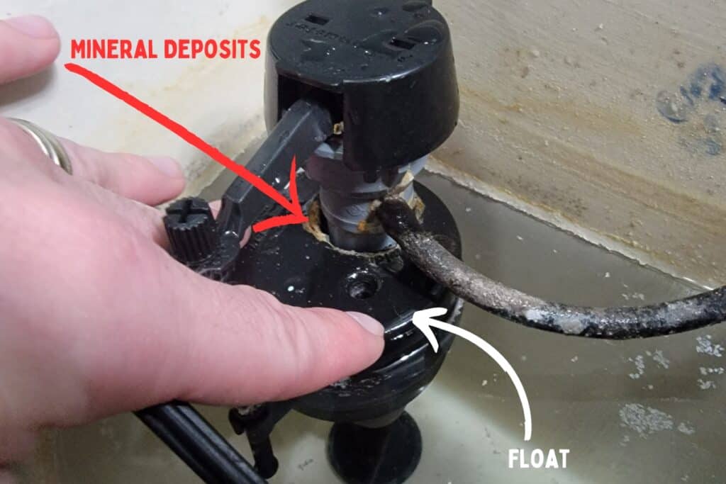 Image showing a float that is stuck and causing a toilet to run.