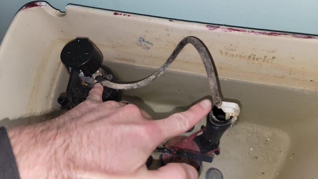 image showing the fill valve hose that could become disconnected and spray out the back of the toilet.