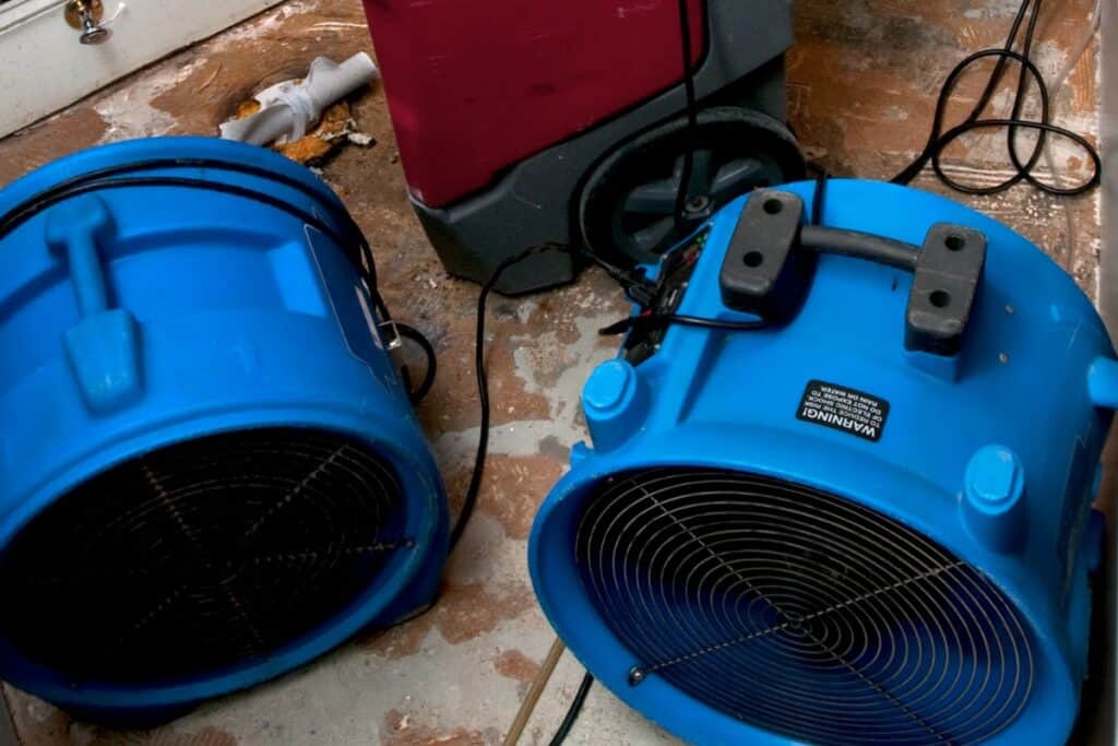 image of floor fans and a water extractor for an upstairs bathroom toilet flood