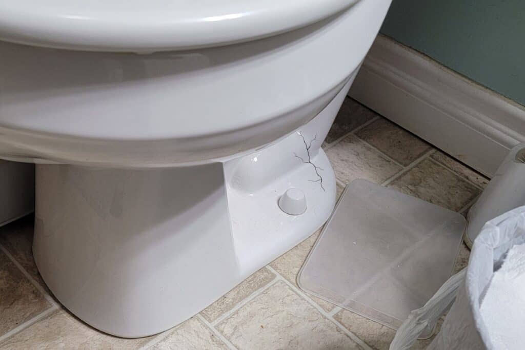 image of a cracked toilet that can lead to a phantom flush