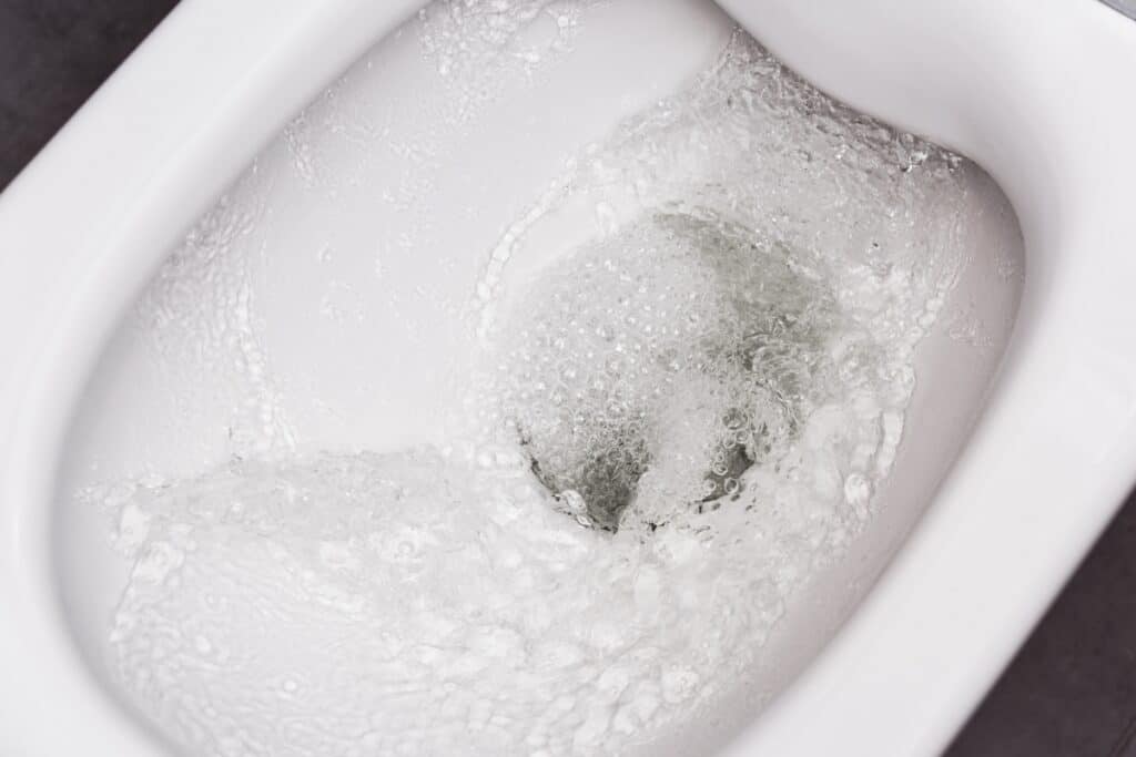 image of water being flushed in toilet